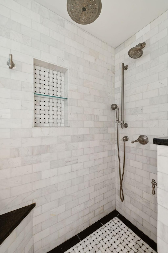 bathroom with a tile shower