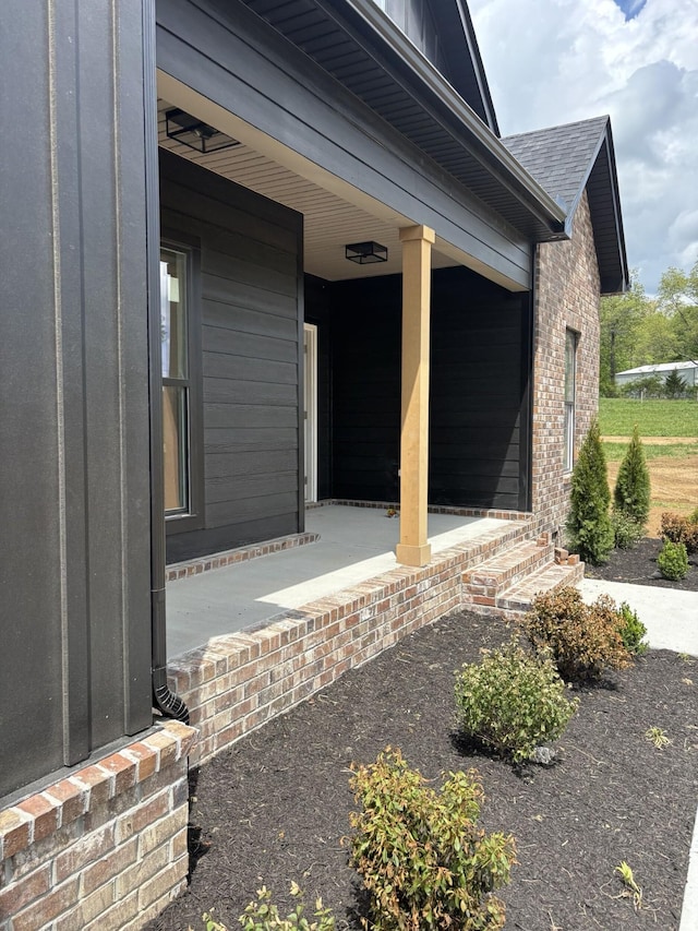 0 Short Mountain Rd, Woodbury, TN 37190 - entrance to property featuring covered porch, brick siding, and a shingled roof
