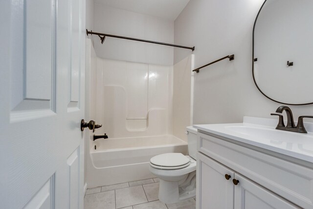bathroom featuring tile patterned floors, vanity, toilet, and  shower combination