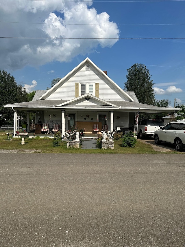 410 College St, Petersburg, TN 37144 - farmhouse inspired home featuring a carport and a porch