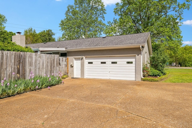 garage featuring fence
