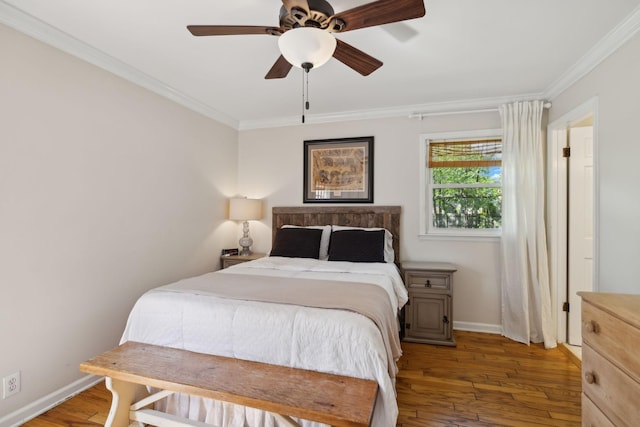 bedroom featuring wood-type flooring, ornamental molding, and baseboards