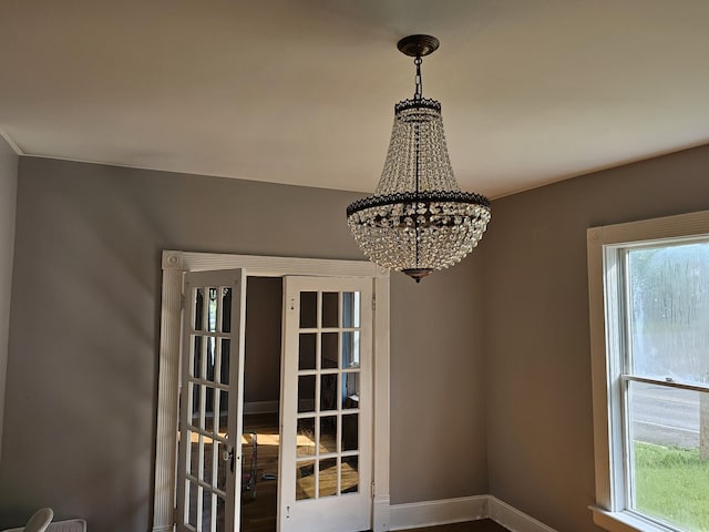 room details with baseboards and a chandelier