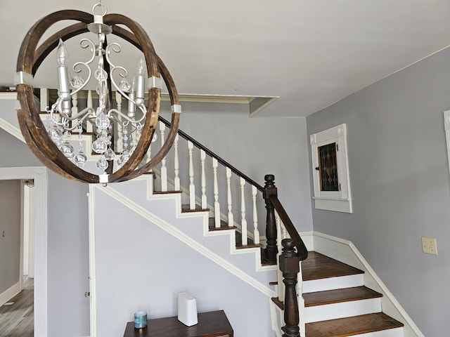 202 W Main St, Decherd, TN 37324 - stairs with a chandelier, baseboards, and wood finished floors