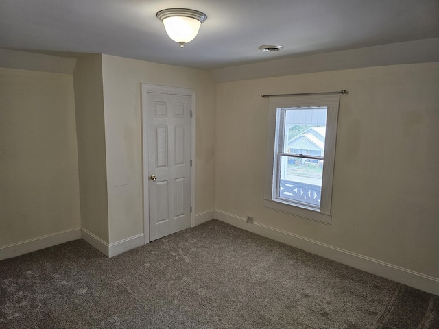 202 W Main St, Decherd, TN 37324 - empty room featuring dark carpet and baseboards