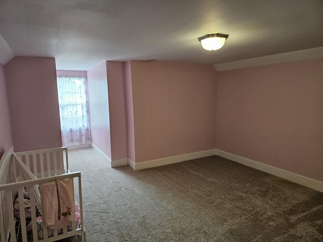 202 W Main St, Decherd, TN 37324 - carpeted empty room featuring baseboards and vaulted ceiling