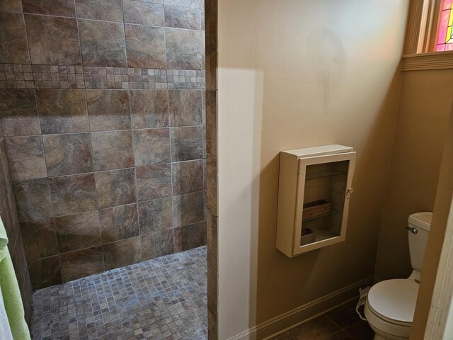202 W Main St, Decherd, TN 37324 - full bath featuring toilet, tiled shower, tile patterned floors, and baseboards