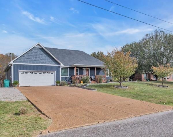ranch-style house with a garage, covered porch, concrete driveway, and a front yard