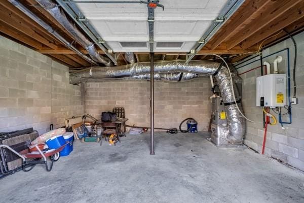 unfinished below grade area featuring water heater