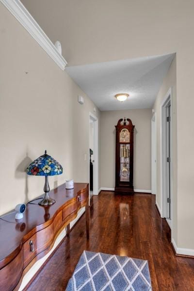 entryway featuring baseboards and wood finished floors