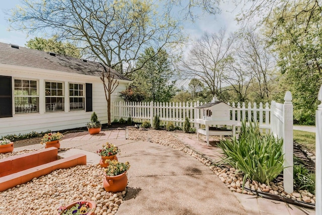 view of yard featuring fence and a patio area