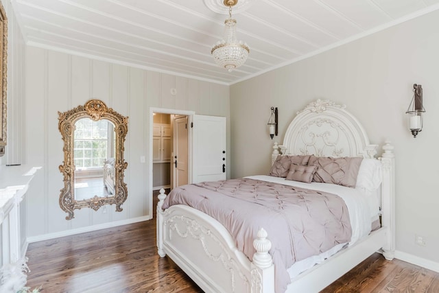 bedroom with crown molding, baseboards, and wood finished floors