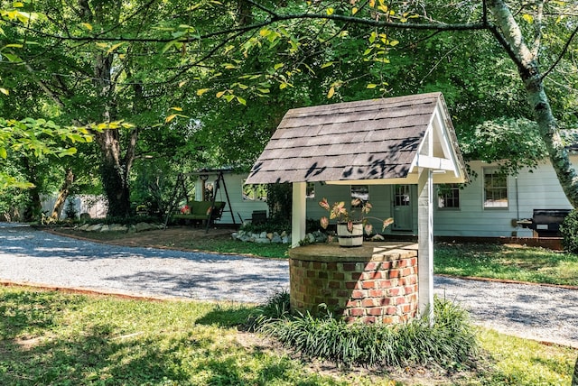 view of property's community with an outbuilding