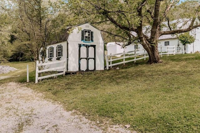 view of shed featuring fence