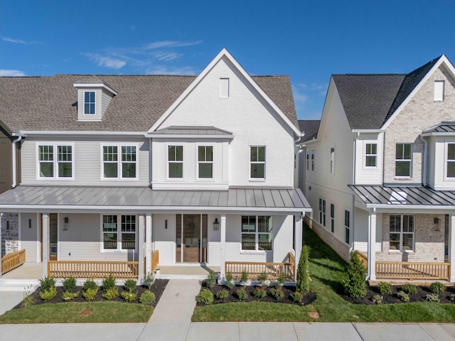 4060 Penfield Dr Unit E, Franklin, TN 37069 - view of front of house featuring a standing seam roof, covered porch, and brick siding