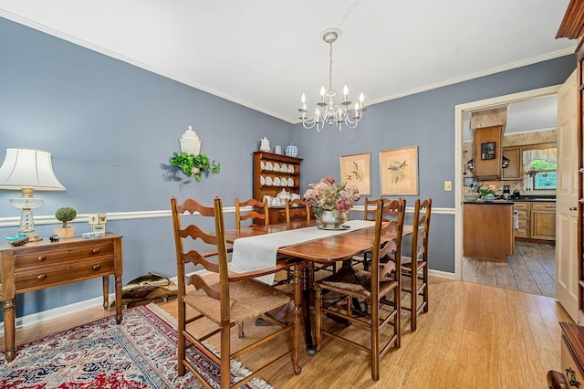 533 Mckaig Rd, Murfreesboro, TN 37127 - dining room featuring a notable chandelier, ornamental molding, and light wood-style flooring