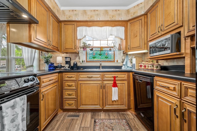 533 Mckaig Rd, Murfreesboro, TN 37127 - kitchen with brown cabinetry, a sink, black appliances, and dark countertops