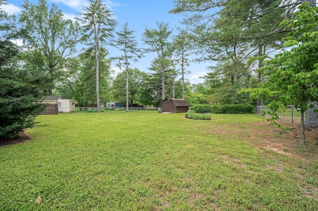 533 Mckaig Rd, Murfreesboro, TN 37127 - view of yard featuring fence, an outdoor structure, and a storage unit