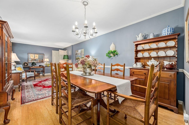 533 Mckaig Rd, Murfreesboro, TN 37127 - dining room featuring a notable chandelier, ornamental molding, and light wood-type flooring