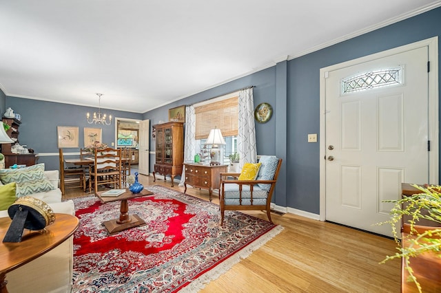 533 Mckaig Rd, Murfreesboro, TN 37127 - living room with baseboards, ornamental molding, wood finished floors, and a chandelier