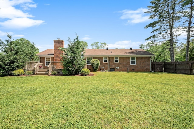533 Mckaig Rd, Murfreesboro, TN 37127 - back of property with fence, a wooden deck, a lawn, and brick siding