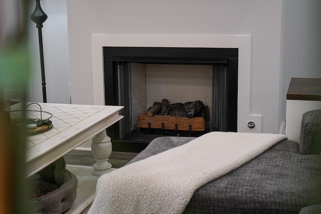 room details with wood finished floors and a fireplace