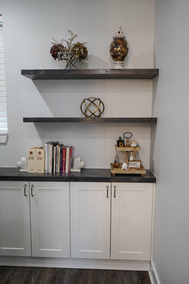 bar featuring dark wood-type flooring
