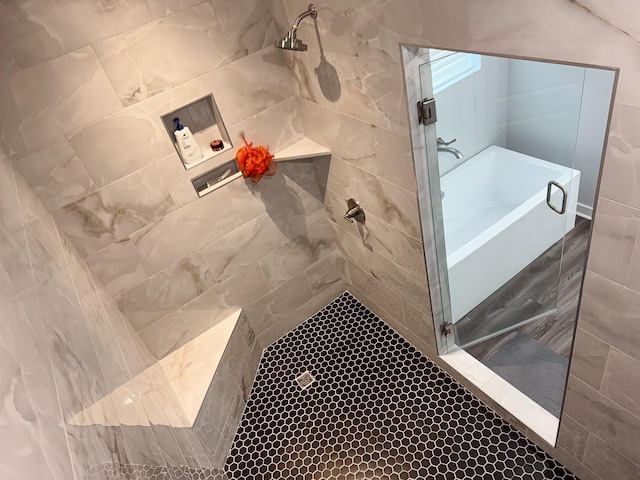 bathroom with a tile shower