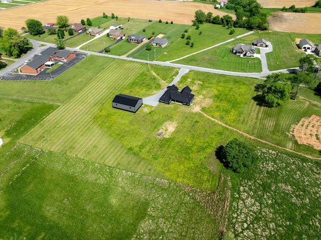 birds eye view of property with a rural view