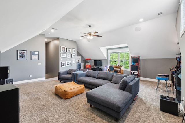 living room with ceiling fan, lofted ceiling, carpet flooring, and visible vents