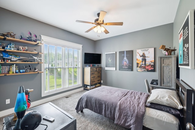 bedroom featuring carpet, a ceiling fan, and visible vents