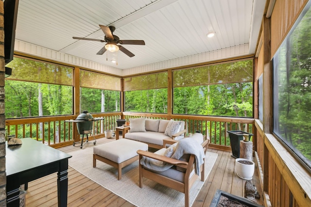 sunroom / solarium with ceiling fan and outdoor lounge area