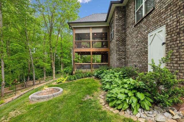 view of yard featuring a sunroom