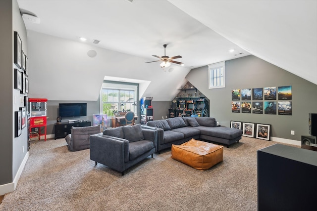 living area featuring visible vents, lofted ceiling, a healthy amount of sunlight, and carpet
