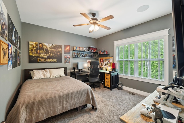 bedroom featuring carpet floors, baseboards, a ceiling fan, and visible vents