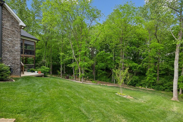 view of yard featuring a sunroom