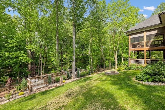 view of yard featuring a sunroom