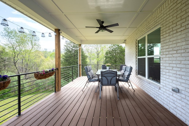wooden deck with ceiling fan and outdoor dining area