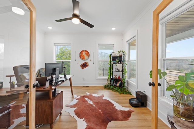 home office featuring baseboards, ornamental molding, a ceiling fan, and wood finished floors