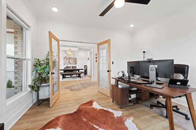 home office with a ceiling fan, french doors, crown molding, wood finished floors, and baseboards