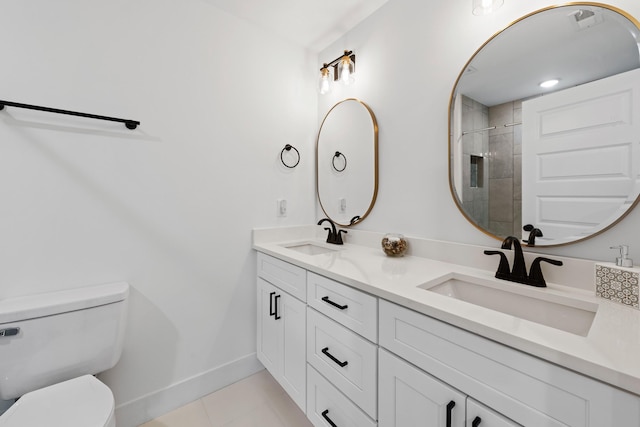 full bath with baseboards, a sink, tile patterned floors, and toilet