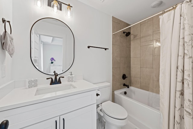 bathroom with shower / bath combo with shower curtain, toilet, and vanity