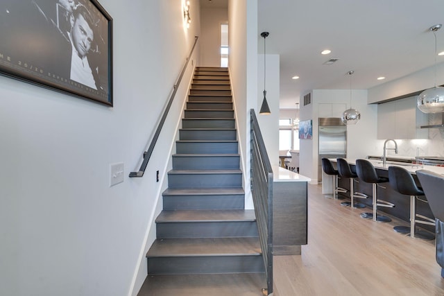 1106 Sigler St, Nashville, TN 37203 - stairs with baseboards, recessed lighting, wood finished floors, and visible vents