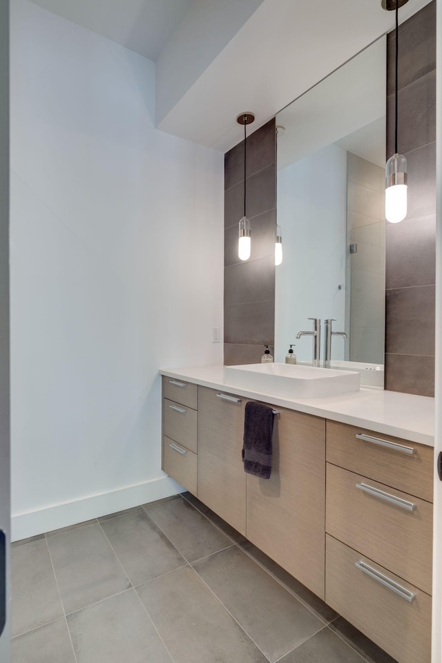 1106 Sigler St, Nashville, TN 37203 - bathroom featuring tile patterned floors, baseboards, and vanity