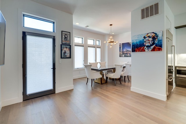 1106 Sigler St, Nashville, TN 37203 - dining space with visible vents, an inviting chandelier, baseboards, recessed lighting, and light wood-style flooring