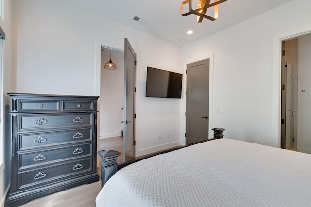 1106 Sigler St, Nashville, TN 37203 - bedroom featuring recessed lighting, baseboards, wood finished floors, and visible vents