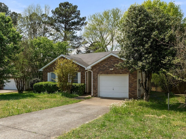ranch-style home featuring concrete driveway, brick siding, an attached garage, and a front lawn