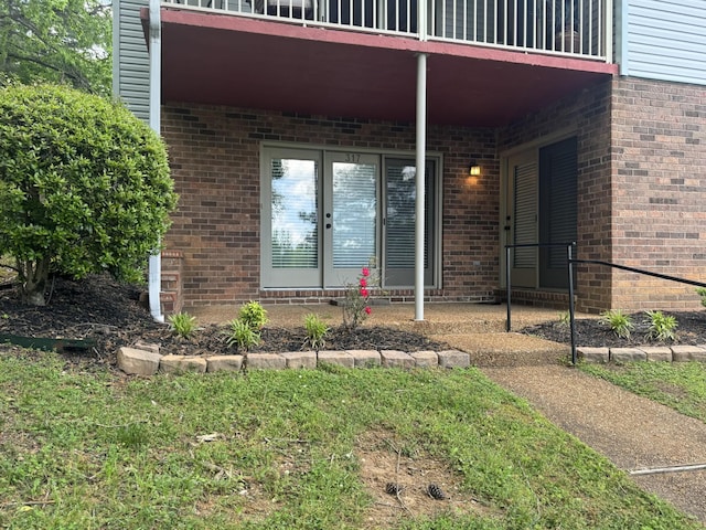 317 Village Ln W, Dickson, TN 37055 - view of exterior entry featuring brick siding