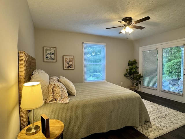 317 Village Ln W, Dickson, TN 37055 - bedroom with a ceiling fan, a textured ceiling, and wood finished floors