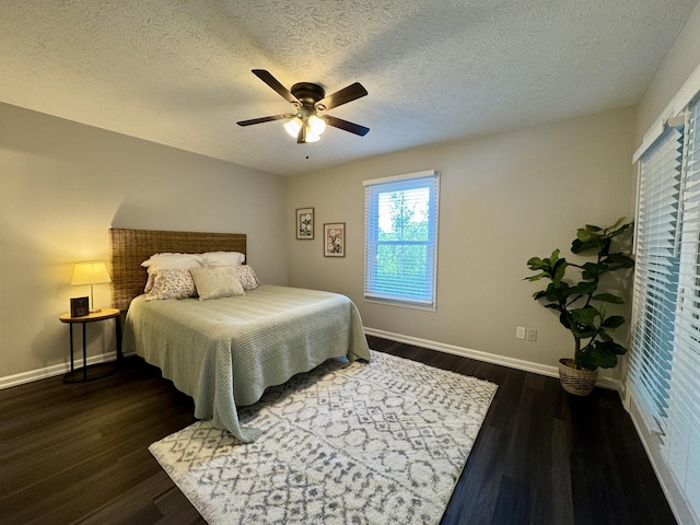 317 Village Ln W, Dickson, TN 37055 - bedroom with baseboards, ceiling fan, dark wood-style flooring, and a textured ceiling